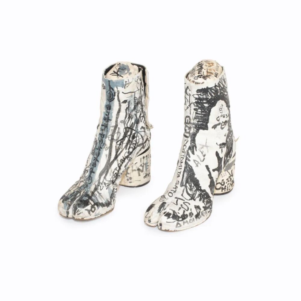 Illustrated white ankle boots on a gray background